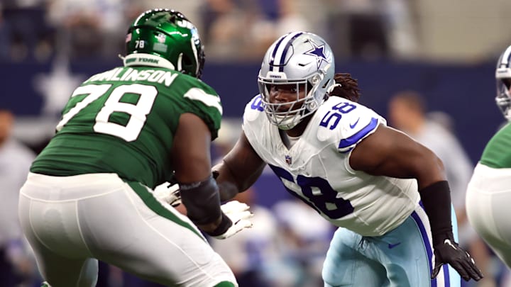 Sep 17, 2023; Arlington, Texas, USA; Dallas Cowboys defensive tackle Mazi Smith (58) rushes the passer while blocked by New York Jets guard Laken Tomlinson (78) in the third quarter at AT&T Stadium. Mandatory Credit: Tim Heitman-Imagn Images