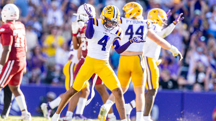 Nov 15, 2025; Baton Rouge, Louisiana, USA;  LSU Tigers cornerback Mansoor Delane (4) reacts to a stop on fourth down against the Arkansas Razorbacks during the second half at Tiger Stadium. Mandatory Credit: Stephen Lew-Imagn Images