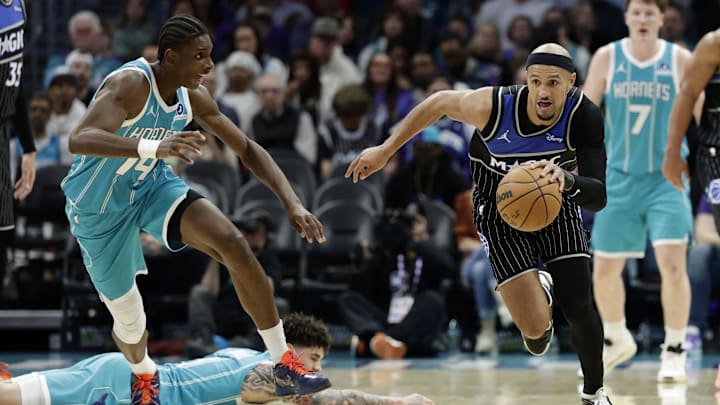 Orlando Magic guard Jalen Suggs (4) runs up court with the ball during the third quarter