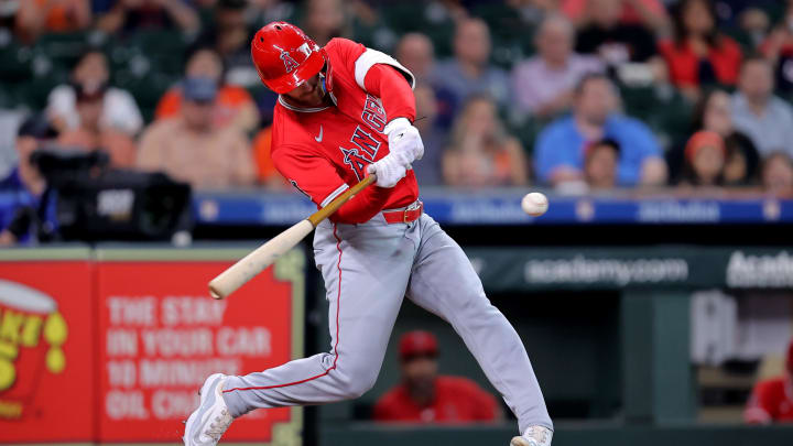 May 20, 2024; Houston, Texas, USA; Los Angeles Angels left fielder Taylor Ward (3) hits a RBI sacrifice fly against the Houston Astros during the first inning at Minute Maid Park. Mandatory Credit: Erik Williams-USA TODAY Sports