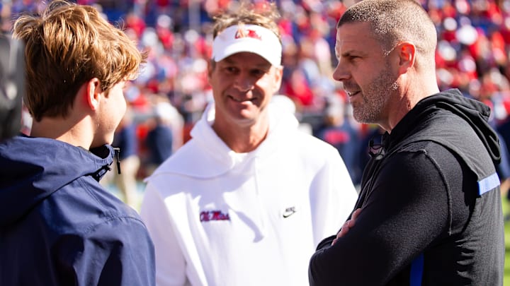 Florida Gators head coach Billy Napier talks with Mississippi Rebels head coach Lane Kiffin before the start of the game at Ben Hill Griffin Stadium in Gainesville, FL on Saturday, November 23, 2024. [Doug Engle/Gainesville Sun]