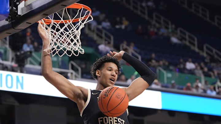 Mar 8, 2023; Greensboro, NC, USA; Wake Forest Demon Deacons forward Bobi Klintman (34) scores in the first half of the second round at Greensboro Coliseum. Mandatory Credit: Bob Donnan-Imagn Images Mar 8, 2023; Greensboro, NC, USA; Wake Forest Demon Deacons forward Bobi Klintman (34) scores in the first half of the second round at Greensboro Coliseum. Mandatory Credit: Bob Donnan-Imagn Images
