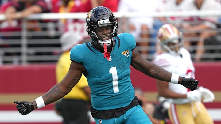 Sep 28, 2025; Santa Clara, California, USA; Jacksonville Jaguars running back Travis Etienne (1) reacts after scoring a touchdown against the San Francisco 49ers during the second quarter at Levi's Stadium. Mandatory Credit: Darren Yamashita-Imagn Images
