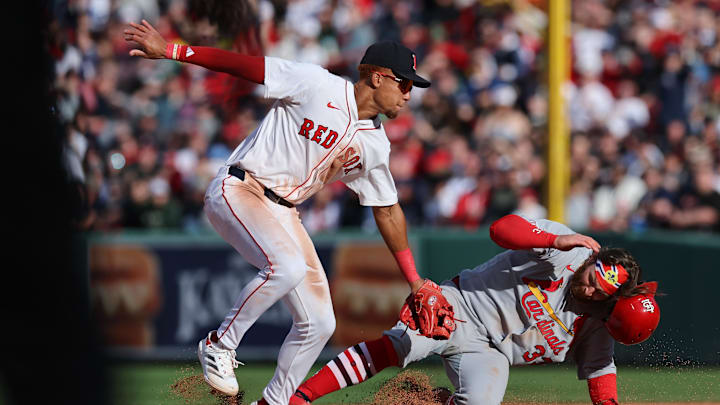 Apr 4, 2025; Boston, Massachusetts, USA; St. Louis Cardinals second baseman Brendan Donovan (33) slides past Boston Red Sox second baseman Kristian Campbell (28) during the ninth inning at Fenway Park. Mandatory Credit: Paul Rutherford-Imagn Images Apr 4, 2025; Boston, Massachusetts, USA; St. Louis Cardinals second baseman Brendan Donovan (33) slides past Boston Red Sox second baseman Kristian Campbell (28) during the ninth inning at Fenway Park. Mandatory Credit: Paul Rutherford-Imagn Images