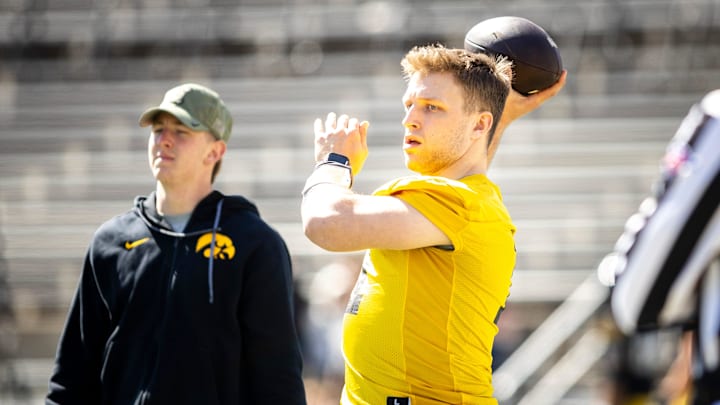 Apr 26, 2025; Iowa City, IA, USA; Iowa quarterback Mark Gronowski (11) throws during a spring NCAA football open practice at Kinnick Stadium. Mandatory Credit: Joseph Cress-The Des Moines Register