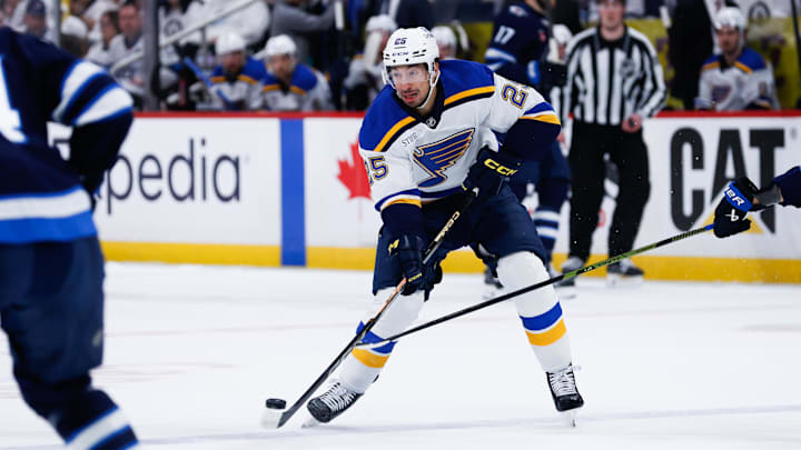 Apr 30, 2025; Winnipeg, Manitoba, CAN; St. Louis Blues forward Jordan Kyrou (25) skates into the Winnipeg Jets zone during the first period in game five of the first round of the 2025 Stanley Cup Playoffs at Canada Life Centre. Mandatory Credit: Terrence Lee-Imagn Images