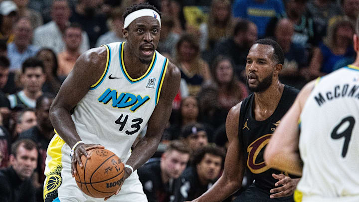 May 11, 2025; Indianapolis, Indiana, USA; Indiana Pacers forward Pascal Siakam (43) holds the ball while Cleveland Cavaliers forward Evan Mobley (4) defends during game four of the second round for the 2025 NBA Playoffs at Gainbridge Fieldhouse. Mandatory Credit: Trevor Ruszkowski-Imagn Images