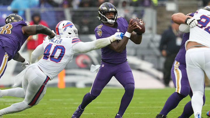 Oct 2, 2022; Baltimore, Maryland, USA; Baltimore Ravens quarterback Lamar Jackson (8) pressured by Buffalo Bills linebacker Von Miller (40) in the second quarter at M&T Bank Stadium. Mandatory Credit: Mitch Stringer-Imagn Images