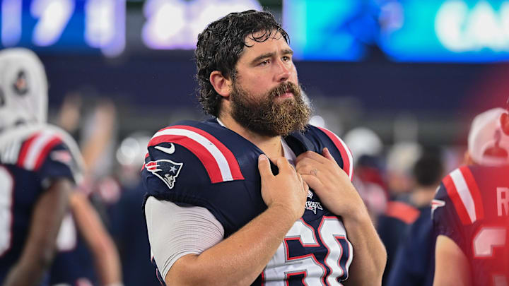 August 8, 2024; Foxborough, MA, USA;  New England Patriots center David Andrews (60) watches from the sideline during the first half against the Carolina Panthers at Gillette Stadium. Mandatory Credit: Eric Canha-Imagn Images