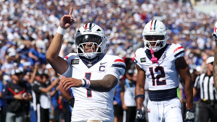 Sep 12, 2026; Provo, Utah, USA; Arizona Wildcats quarterback Noah Fifita (1) celebrates scoring a touchdown against the BYU Cougars during the first quarter at LaVell Edwards Stadium. Sep 12, 2026; Provo, Utah, USA; Arizona Wildcats quarterback Noah Fifita (1) celebrates scoring a touchdown against the BYU Cougars during the first quarter at LaVell Edwards Stadium.