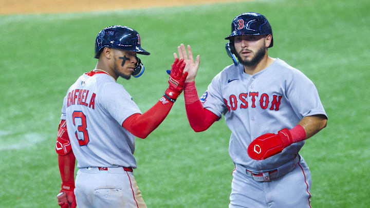 Arlington, Texas, USA; Boston Red Sox right fielder Wilyer Abreu (52) celebrates with Boston Red Sox center fielder Ceddanne Rafaela (3) after scoring during the sixth inning against the Texas Rangers at Globe Life Field.