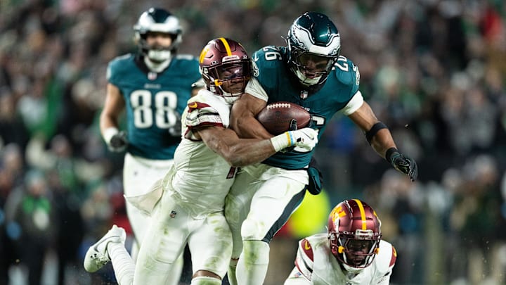 Nov 14, 2024; Philadelphia, Pennsylvania, USA; Philadelphia Eagles running back Saquon Barkley (26) runs with the ball against Washington Commanders safety Jeremy Chinn (11)