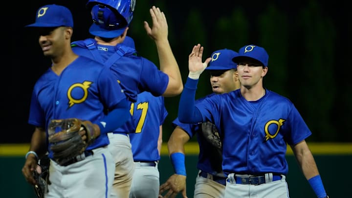 Sep 14, 2022; Columbus, OH, USA;  Omaha Storm Chasers players high five following their 9-1 win during the Minor Leage Baseball game at Huntington Park. Mandatory Credit: Adam Cairns-The Columbus Dispatch

Clippers 0914 Ac 30