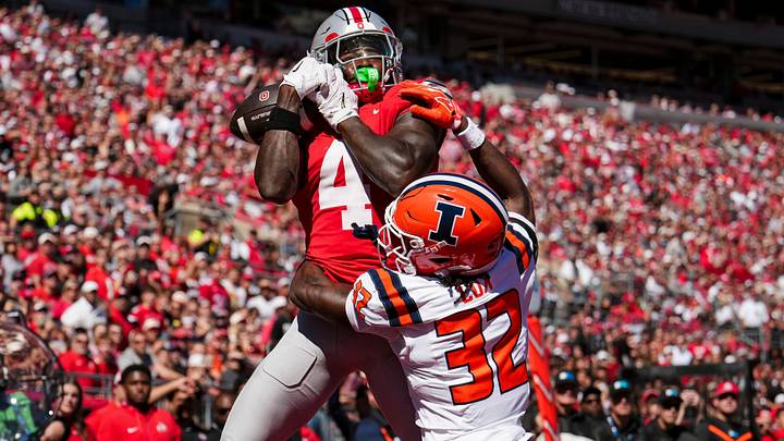 Ohio State Buckeyes wide receiver Jeremiah Smith (4) catches a touchdown over Illinois Fighting Illini defensive back Tywan Cox (32) during the NCAA football game at Ohio Stadium in Columbus on Sept. 26, 2026. Ohio State Buckeyes wide receiver Jeremiah Smith (4) catches a touchdown over Illinois Fighting Illini defensive back Tywan Cox (32) during the NCAA football game at Ohio Stadium in Columbus on Sept. 26, 2026.
