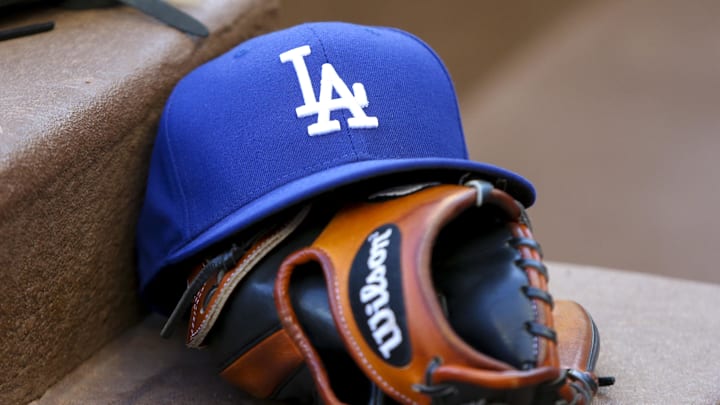 Aug 16, 2019; Atlanta, GA, USA; Detailed view of Los Angeles Dodgers hat and glove in the dugout against the Atlanta Braves in the first inning at SunTrust Park. Mandatory Credit: Brett Davis-Imagn Images