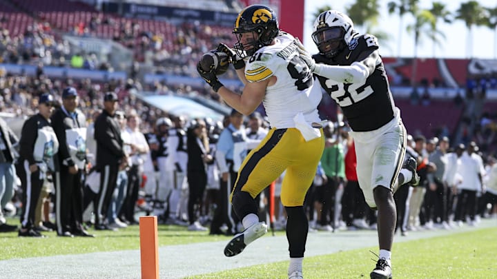 Dec 31, 2025; Tampa, FL, USA; Iowa Hawkeyes tight end DJ Vonnahme (81) receives a pass for a touchdown defended by Vanderbilt Commodores linebacker Bryce Cowan (22) in the third quarter during the ReliaQuest Bowl at Raymond James Stadium. Mandatory Credit: Nathan Ray Seebeck-Imagn Images Dec 31, 2025; Tampa, FL, USA; Iowa Hawkeyes tight end DJ Vonnahme (81) receives a pass for a touchdown defended by Vanderbilt Commodores linebacker Bryce Cowan (22) in the third quarter during the ReliaQuest Bowl at Raymond James Stadium. Mandatory Credit: Nathan Ray Seebeck-Imagn Images