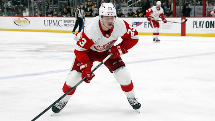 Detroit Red Wings left wing Lucas Raymond (23) skates toward the puck. 