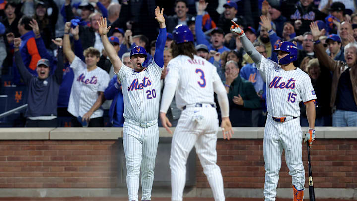Oct 18, 2024; New York City, New York, USA; New York Mets first baseman Pete Alonso (20) and designated hitter Jesse Winker (3) react after scoring on a two-run double by right fielder Starling Marte (not pictured) during the third inning of game five of the NLCS against the Los Angeles Dodgers during the 2024 MLB playoffs at Citi Field. Mandatory Credit: Brad Penner-Imagn Images