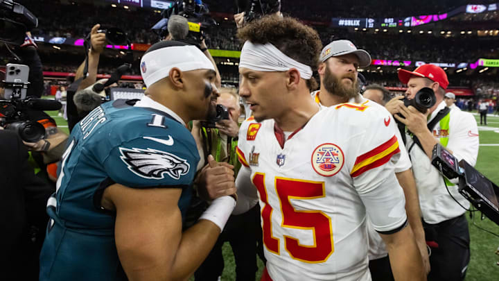 Feb 9, 2025; New Orleans, LA, USA; Philadelphia Eagles quarterback Jalen Hurts (1) greets Kansas City Chiefs quarterback Patrick Mahomes (15) following Super Bowl LIX at Ceasars Superdome. Mandatory Credit: Mark J. Rebilas-Imagn Images