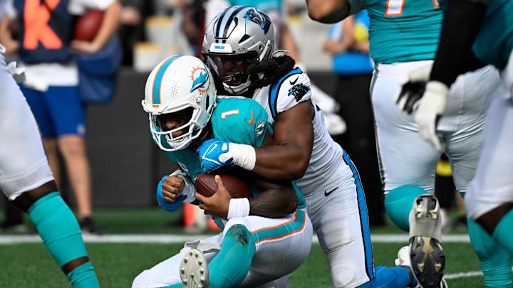 Carolina Panthers linebacker Patrick Jones II (91) sacks Miami Dolphins quarterback Tua Tagovailoa (1) on third down late in the fourth quarter at Bank of America Stadium.
