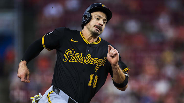 Sep 24, 2025; Cincinnati, Ohio, USA; Pittsburgh Pirates outfielder Bryan Reynolds (10) scores on a double hit by first baseman Spencer Horwitz (not pictured) in the fourth inning against the Cincinnati Reds at Great American Ball Park. Mandatory Credit: Katie Stratman-Imagn Images