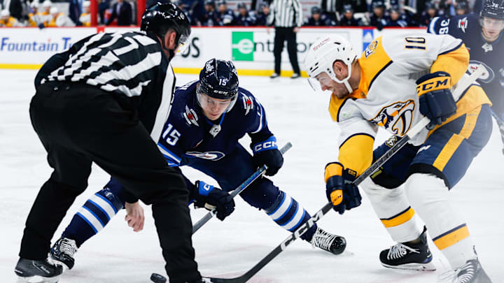 Mar 13, 2024; Winnipeg, Manitoba, CAN; Winnipeg Jets forward Rasmus Kupari (15) faces off against