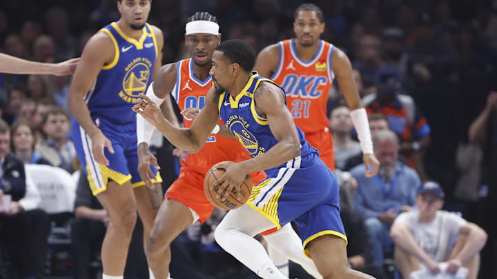 Nov 10, 2024; Oklahoma City, Oklahoma, USA; Golden State Warriors guard De'Anthony Melton (8) drives to the basket beside Oklahoma City Thunder guard Shai Gilgeous-Alexander (2) during the first quarter at Paycom Center. Mandatory Credit: Alonzo Adams-Imagn Images