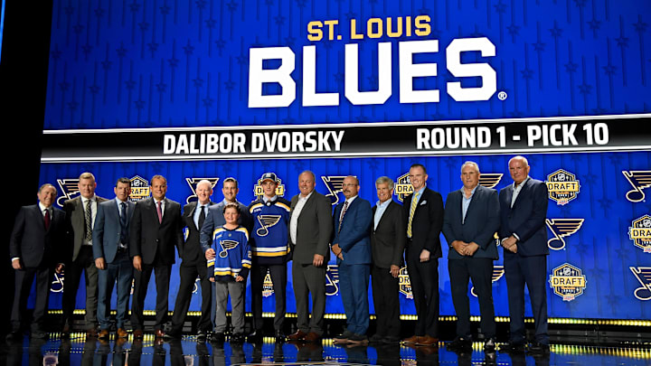 Jun 28, 2023; Nashville, Tennessee, USA; St. Louis Blues draft pick Dalibor Dvorsky stands with Blues staff after being selected with the tenth pick in round one of the 2023 NHL Draft at Bridgestone Arena. Mandatory Credit: Christopher Hanewinckel-Imagn Images