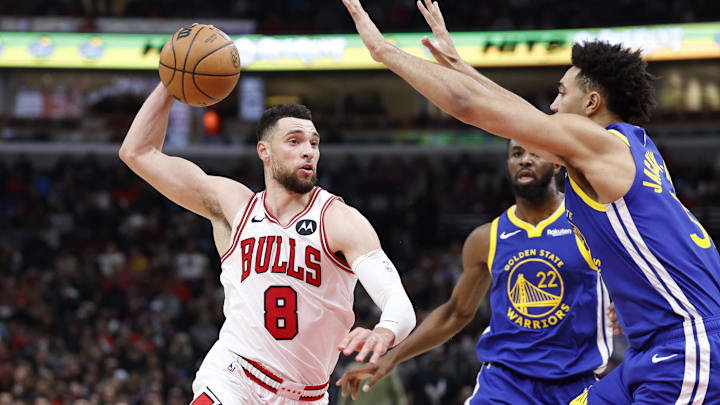 Jan 12, 2024; Chicago, Illinois, USA; Chicago Bulls guard Zach LaVine (8) drives against Golden State Warriors forward Trayce Jackson-Davis (32) during the second half at United Center. Mandatory Credit: Kamil Krzaczynski-USA TODAY Sports
