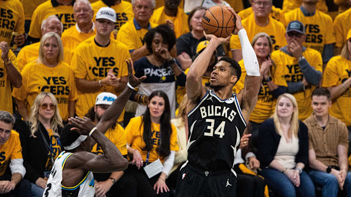 Apr 29, 2025; Indianapolis, Indiana, USA; Milwaukee Bucks forward Giannis Antetokounmpo (34) shoots the ball while  Indiana Pacers forward Pascal Siakam (43) defends during game five of the first round for the 2024 NBA Playoffs at Gainbridge Fieldhouse. Mandatory Credit: Trevor Ruszkowski-Imagn Images