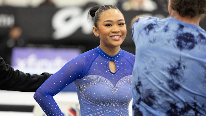 Olympic gold medalist Suni Lee with coach Jess Graba during the 2024 Winter Cup senior women s gymnastics competition.