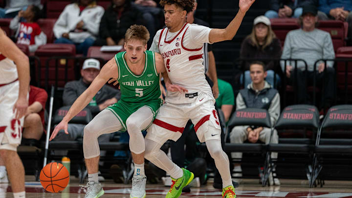 Dec 3, 2024; Stanford, California, USA; Utah Valley Wolverines guard Tanner Toolson (5) is guarded by Stanford Cardinal guard Oziyah Sellers (4) during the first quarter at Maples Pavilion. Mandatory Credit: Neville E. Guard-Imagn Images Dec 3, 2024; Stanford, California, USA; Utah Valley Wolverines guard Tanner Toolson (5) is guarded by Stanford Cardinal guard Oziyah Sellers (4) during the first quarter at Maples Pavilion. Mandatory Credit: Neville E. Guard-Imagn Images