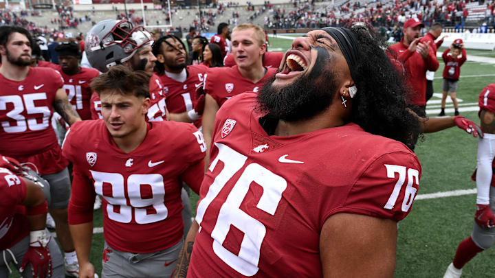 Washington State Cougars offensive lineman Esa Pole celebrates after a game against the Hawaii Warriors. Washington State Cougars offensive lineman Esa Pole celebrates after a game against the Hawaii Warriors.