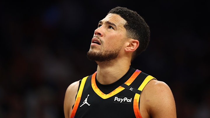 Apr 9, 2025; Phoenix, Arizona, USA; Phoenix Suns guard Devin Booker (1) reacts after a play against the Oklahoma City Thunder during the first half at Footprint Center. Mandatory Credit: Mark J. Rebilas-Imagn Images