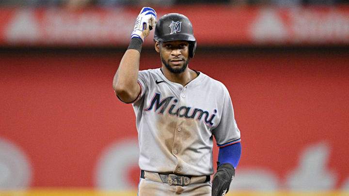 Miami Marlins shortstop Otto Lopez (6) looks on from second base after he hits a double and drives in a run against the Texas Rangers during the fourth inning at Globe Life Field.