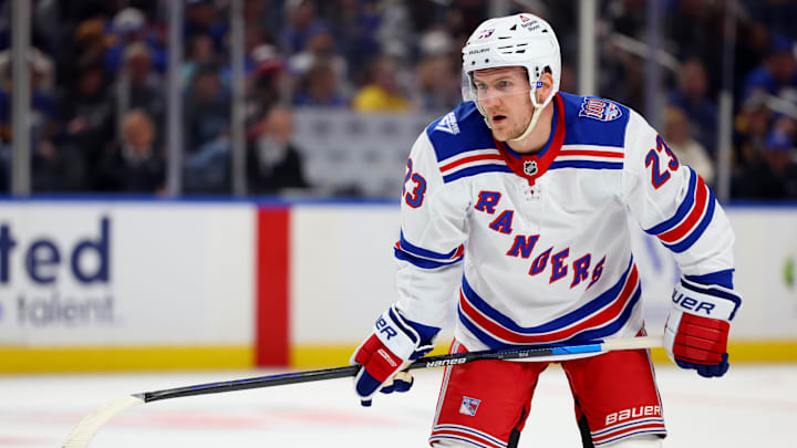 Oct 9, 2025; Buffalo, New York, USA;  New York Rangers defenseman Adam Fox (23) waits for the face-off during the second period against the Buffalo Sabres at KeyBank Center. Mandatory Credit: Timothy T. Ludwig-Imagn Images