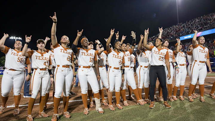 Jun 4, 2025; Oklahoma City, OK, USA;  Texas Longhorns players chant towards the fans after defeating the Texas Tech Red Raiders 2-1 in game one of the NCAA Softball Women's College World Series finals at Devon Park. Mandatory Credit: Brett Rojo-Imagn Images