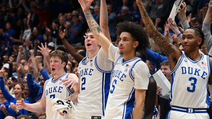 Mar 3, 2025; Durham, North Carolina, USA; Duke Blue Devils forward Kon Knueppel (7) forward Cooper Flagg (2) guard Tyrese Proctor (5) and forward Isaiah Evans (3) react during the second half against the Wake Forest Demon Deacons at Cameron Indoor Stadium. The Blue Devils won 93-60. Mandatory Credit: Rob Kinnan-Imagn Images Mar 3, 2025; Durham, North Carolina, USA; Duke Blue Devils forward Kon Knueppel (7) forward Cooper Flagg (2) guard Tyrese Proctor (5) and forward Isaiah Evans (3) react during the second half against the Wake Forest Demon Deacons at Cameron Indoor Stadium. The Blue Devils won 93-60. Mandatory Credit: Rob Kinnan-Imagn Images