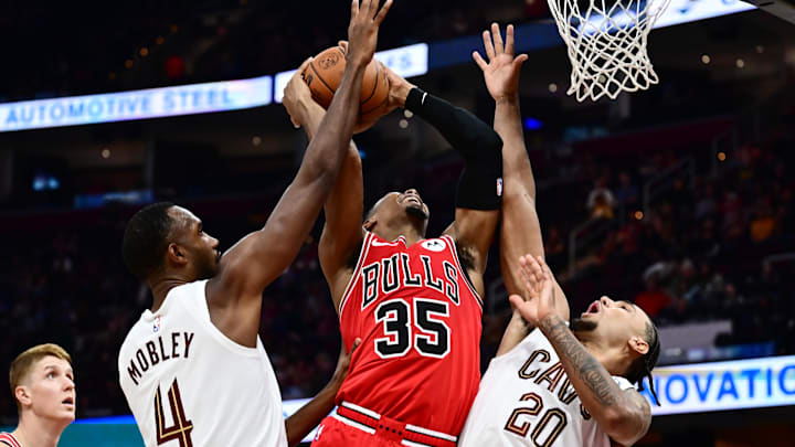 Oct 7, 2025; Cleveland, Ohio, USA; Chicago Bulls guard Isaac Okoro (35) drives to the basket between Cleveland Cavaliers forward Evan Mobley (4) and forward Jaylon Tyson (20) during the second half at Rocket Arena. Mandatory Credit: Ken Blaze-Imagn Images Oct 7, 2025; Cleveland, Ohio, USA; Chicago Bulls guard Isaac Okoro (35) drives to the basket between Cleveland Cavaliers forward Evan Mobley (4) and forward Jaylon Tyson (20) during the second half at Rocket Arena. Mandatory Credit: Ken Blaze-Imagn Images