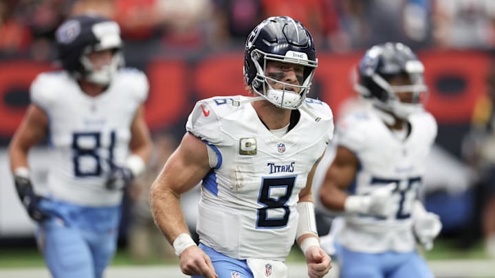 Nov 24, 2024; Houston, Texas, USA; Tennessee Titans quarterback Will Levis (8) runs off the field after throwing a touchdown pass against the Houston Texans in the first quarter at NRG Stadium. Mandatory Credit: Thomas Shea-Imagn Images