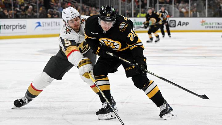 Jan 22, 2026; Boston, Massachusetts, USA; Boston Bruins center Alex Steeves (21) and Vegas Golden Knights defenseman Jeremy Lauzon (5) battle for the puck during the first period at the TD Garden. Mandatory Credit: Brian Fluharty-Imagn Images Jan 22, 2026; Boston, Massachusetts, USA; Boston Bruins center Alex Steeves (21) and Vegas Golden Knights defenseman Jeremy Lauzon (5) battle for the puck during the first period at the TD Garden. Mandatory Credit: Brian Fluharty-Imagn Images