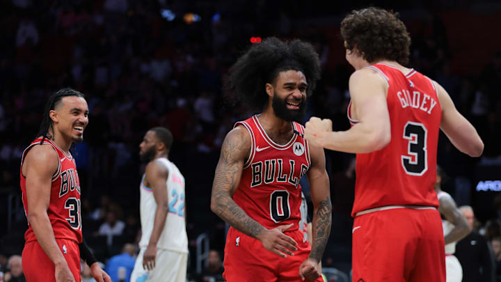 Mar 8, 2025; Miami, Florida, USA; Chicago Bulls guard Coby White (0) celebrates with guard Josh Giddey (3) after the game against the Miami Heat at Kaseya Center. Mandatory Credit: Sam Navarro-Imagn Images