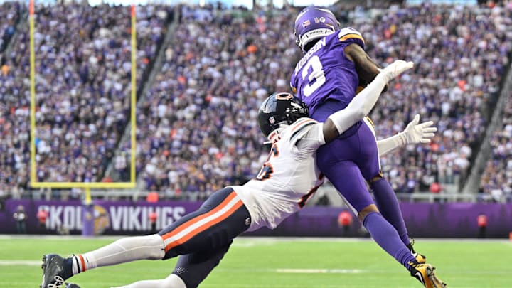 Nov 16, 2025; Minneapolis, Minnesota, USA; Vikings WR Jordan Addison catches a pass under pressure from Bears CB Nahshon Wright at U.S. Bank Stadium. Jeffrey Becker-Imagn Images
