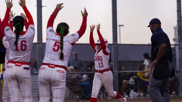 Socorro players celebrate Danna Guerrero’s (13) home run during a District 1-6A game against Eastlake at Eastlake High School on Tuesday, March 17, 2026, in El Paso, Texas.