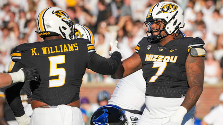 Sep 7, 2024; Columbia, Missouri, USA; Missouri Tigers defensive tackle Chris McClellan (7) celebrates with defensive tackle Kristian Williams (5) after a play against the Buffalo Bulls during the game at Faurot Field at Memorial Stadium. Mandatory Credit: Denny Medley-Imagn Images Sep 7, 2024; Columbia, Missouri, USA; Missouri Tigers defensive tackle Chris McClellan (7) celebrates with defensive tackle Kristian Williams (5) after a play against the Buffalo Bulls during the game at Faurot Field at Memorial Stadium. Mandatory Credit: Denny Medley-Imagn Images