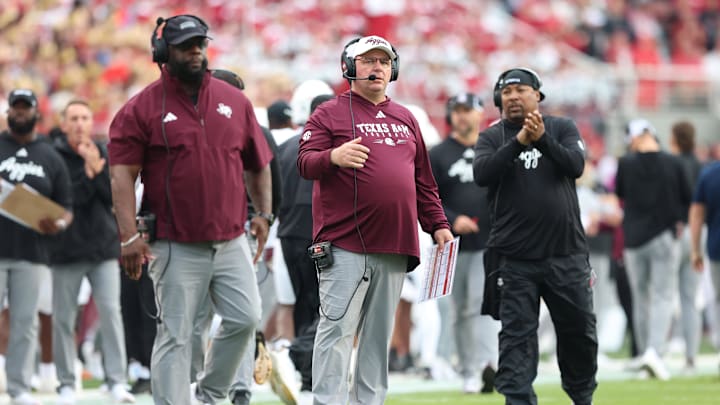 Oct 18, 2025; Fayetteville, Arkansas, USA; Texas A&M Aggies head coach Mike Elko during the first quarter against the Arkansas Razorbacks at Donald W. Reynolds Razorback Stadium. Mandatory Credit: Nelson Chenault-Imagn Images Oct 18, 2025; Fayetteville, Arkansas, USA; Texas A&M Aggies head coach Mike Elko during the first quarter against the Arkansas Razorbacks at Donald W. Reynolds Razorback Stadium. Mandatory Credit: Nelson Chenault-Imagn Images