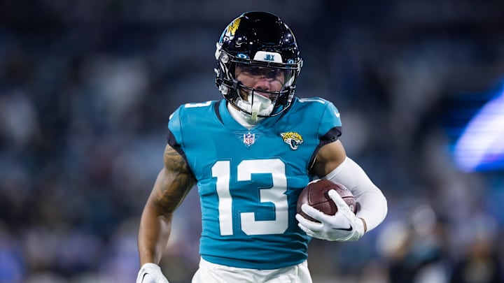 Jan 14, 2023; Jacksonville, Florida, USA; Jacksonville Jaguars wide receiver Christian Kirk (13) against the Los Angeles Chargers during a wild card playoff game at TIAA Bank Field. Mandatory Credit: Mark J. Rebilas-Imagn Images