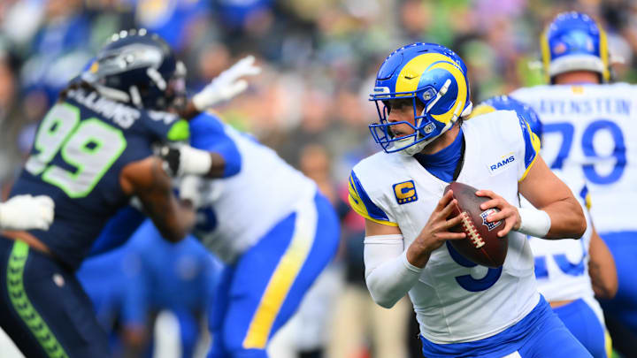 Nov 3, 2024; Seattle, Washington, USA; Los Angeles Rams quarterback Matthew Stafford (9) looks to pass the ball against the Seattle Seahawks during the first half at Lumen Field. Mandatory Credit: Steven Bisig-Imagn Images