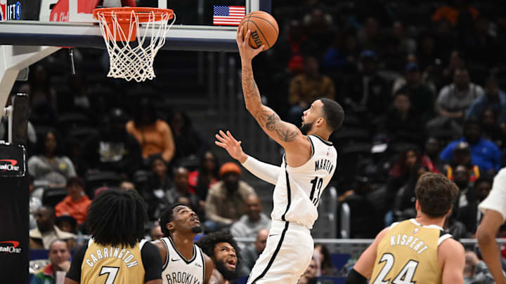 Nov 16, 2025; Washington, District of Columbia, USA;  Brooklyn Nets guard Tyrese Martin (13) attempts a lay up against the Washington Wizards during the third quarter at Capital One Arena. Mandatory Credit: Rafael Suanes-Imagn Images