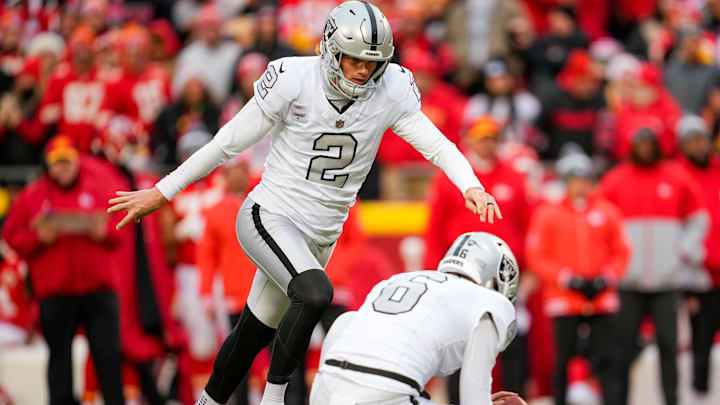 Dec 25, 2023; Kansas City, Missouri, USA; Las Vegas Raiders place kicker Daniel Carlson (2) kicks a field goal during the second half against the Kansas City Chiefs at GEHA Field at Arrowhead Stadium. Mandatory Credit: Jay Biggerstaff-Imagn Images